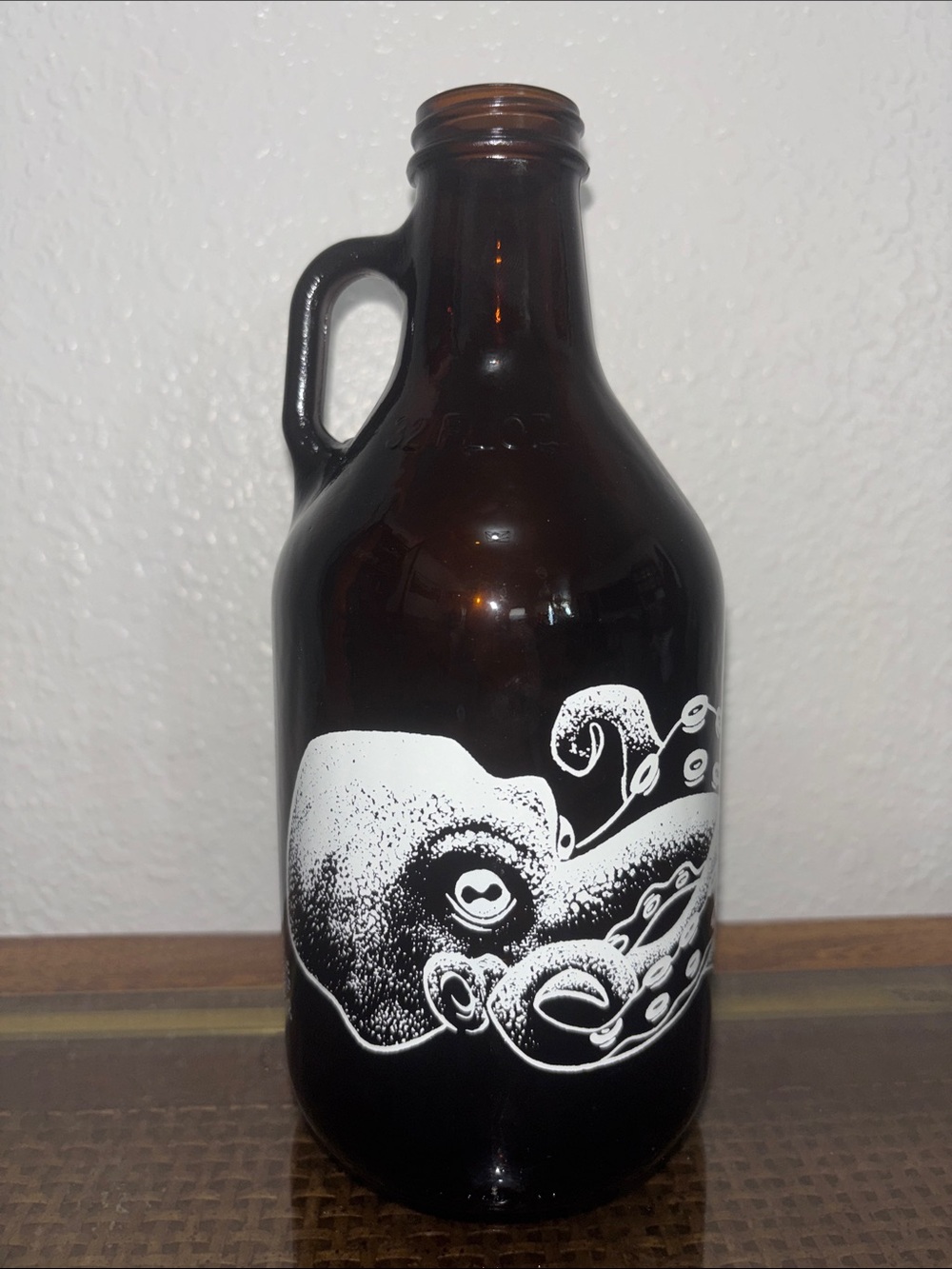 Amber Glass Growler with White Octopus Graphic